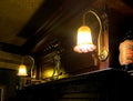 Hunting pub decorated in the old English style. antique furniture made of red oak and beech, deer figures, rare books, dishes,