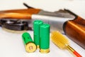 Hunting rifle cartridges and ramrod. Ammunition and cleaning agents for firearms. Foreground Royalty Free Stock Photo