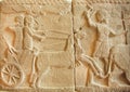 Hunting scene on ancient Assyrian bas-relief from 8th century BC