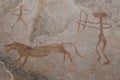 A hunting scene on the wall of the cave.