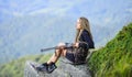 Hunting season. Hunter mountains landscape background. Sexy warrior. Aiming concept. Amazon girl sit on cliff prepare