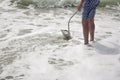 Hunting for shark teeth on Venice beach Florida