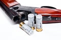 Hunting shotgun and ammunition on white background. Royalty Free Stock Photo