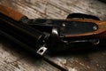 Hunting shotgun riffle on old rustic wooden table Royalty Free Stock Photo