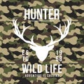 Hunting style t-shirt design with deer antlers on camouflage background. T-shirt graphic