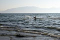 Vlore Vlora, Albania - August 15 2020: Hunting for Sunset. Fisherman throwing fishing net into the sea, Vlore, Albania Royalty Free Stock Photo