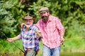 hunting tourism. father and son fishing. Camping on the shore of lake. concept of a rural getaway. hobby. Fly Fishing Royalty Free Stock Photo