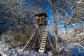 Hunting tower at the edge of the winter forest Royalty Free Stock Photo