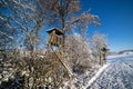 Hunting tower at the edge of the winter forest Royalty Free Stock Photo