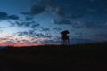 Hunting tower, hide, lookout in dusk with cloudscape Royalty Free Stock Photo