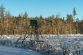 Hunting tower in a Swedish forest in winter sunlight Royalty Free Stock Photo