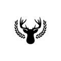 Hunting trophy. Deer head with big antlers in laurel wreath isolated on white background Royalty Free Stock Photo