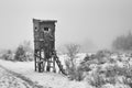 Wooden hunting tower with ladder in winter Royalty Free Stock Photo