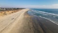 Huntington Beach - CA - Aerial Fast Forward Dolly above the beach and surf