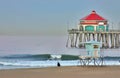 Huntington Beach Pier and Surfer at Dawn Royalty Free Stock Photo