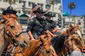 Equestrian police officers from Huntington Beach and Santa Ana Police Departments in front of the Huntington Beach Pier