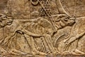 Huntsmen with hounds in a garden Assyrian, about 645-635 BC From Nineveh, North Palace Royalty Free Stock Photo