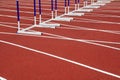 Hurdle bracket on red plastic runway Royalty Free Stock Photo