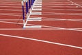 Hurdle bracket on red plastic runway Royalty Free Stock Photo