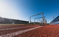 Hurdle race barrier on stadium track at sunny day. Blue sky Royalty Free Stock Photo