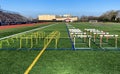Hurdles set up for stength and agility practice on a turf athletic field Royalty Free Stock Photo