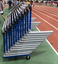 Hurdles stacked up next to an indoor track Royalty Free Stock Photo