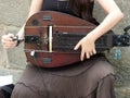 Playing the hurdy-gurdy