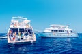Hurghada, Egypt. August 3, 2014 - White ship with divers moored near a coral reef