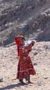 Bedouin children entertain tourists. Kids of the Sahara desert. An aboriginal child with a bottle of water