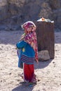 Bedouin children entertain tourists. Kids of the Sahara desert. Baby and candy