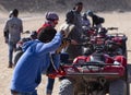 Funny Arab photographer. Photographing tourists during a Safari in the Sahara desert