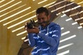 Funny Arab photographer. Photographing tourists during a Safari in the Sahara desert