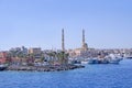 View of embankment of Hurghada with moored yachts, ships and beautiful mosque