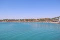 Tropical resort in Egypt. People swimming in sea. Tourists relax on beach Royalty Free Stock Photo