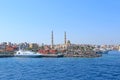 View of embankment of Hurghada with moored yachts, ships and beautiful mosque