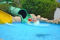 Slide down the water park. Family vacation. Royalty Free Stock Photo