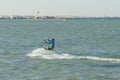 Hurghada, Egypt. November 19 2018 Kitesurfing Kiteboarding action photos man among waves quickly goes. A kite surfer rides the