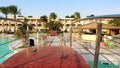 HURGHADA, EGYPT - OCTOBER 24, 2018: hotel Prima Life. beautiful red bridge over the swimming pool at the hotel. pigeons