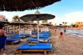 HURGHADA, EGYPT - OCTOBER 14, 2013: Sandy beach full of people is on the Red Sea coastline. Luxury resort hotel on Red Sea beach t Royalty Free Stock Photo