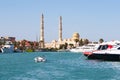 HURGHADA, EGYPT - September 22, 2021 : Mosque El Mina Masjid and the marina with the ships in Hurghada in sunny day, view from the Royalty Free Stock Photo