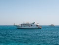 Hurghada, Egypt - September 22, 2021: People ride and relax on a large yacht on the azure red sea. Tourists are offered snorkeling