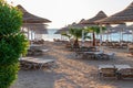 Sunrise on the beach with parasol overlooking the Red Sea in Hurghada, Egypt Royalty Free Stock Photo