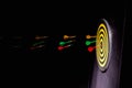 hurl darts on dartboard Royalty Free Stock Photo