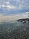 Huron Lake Sunset Goderich beach stones clear water evening Ontario Canada landscape Royalty Free Stock Photo