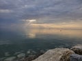 Huron Lake Sunset Goderich beach stones clear water evening Ontario Canada landscape Royalty Free Stock Photo