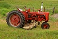 Old Farmall C tractor with a belly mower