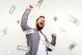 Hurray I am winner and rich now! Portrait of winner man raising hands, screaming yes i did it, joyful reacting to success, victory