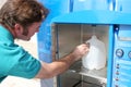 Hurrican Preparedness - Filling Water Bottle Royalty Free Stock Photo