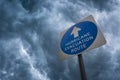 Hurricane Evacuation Sign Against a Stormy Sky Royalty Free Stock Photo