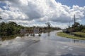 Hurricane flooded street with road closed signs blocking driving of cars. Safety of transportation during natural Royalty Free Stock Photo